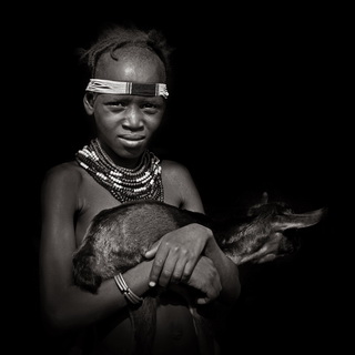 Omorate - Dassanech girl with small goat